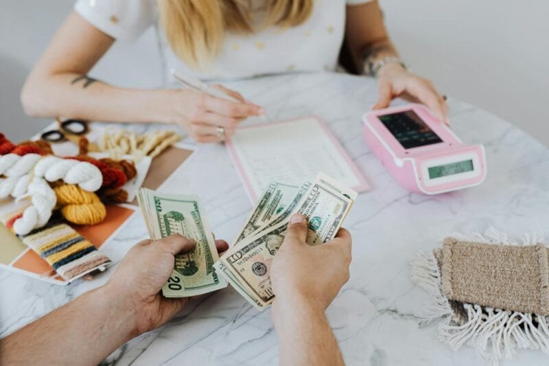 pexels-photo-4968631 | Beyond The Punchlines counting dollar bills